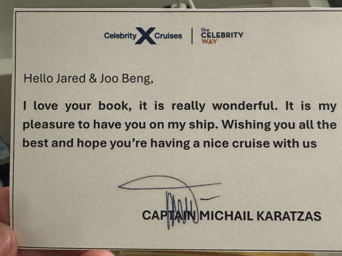 Handwritten Celebrity Cruises card from Captain Michail Karatzas: "Hello Jared & Joo Beng, I love your book, it is really wonderful. It is my pleasure to have you on my ship. Wishing you all the best and hope you're having a nice cruise with us."